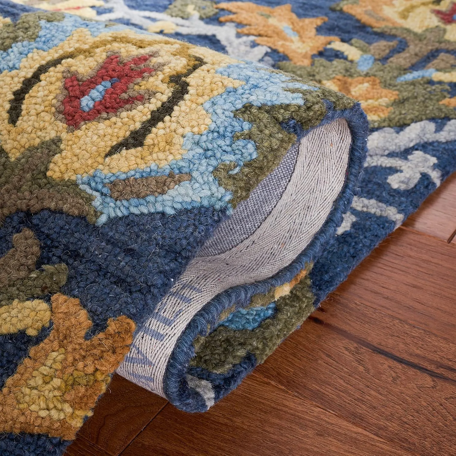 SAFAVIEH Blossom Collection Area Rug - 8' x 10', Navy & Multi, Handmade Wool, Ideal for High Traffic Areas in Living Room, Bedroom (BLM402A)